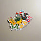 A charming illustration of Lisbon showcases colorful "LISBOA" letters at the bottom. Iconic elements include a classic yellow tram, a prominent red-roofed tower, and the famous Barcelos Rooster, making it an ideal souvenir from Portugal.