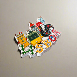 A charming illustration of Lisbon showcases colorful "LISBOA" letters at the bottom. Iconic elements include a classic yellow tram, a prominent red-roofed tower, and the famous Barcelos Rooster, making it an ideal souvenir from Portugal.