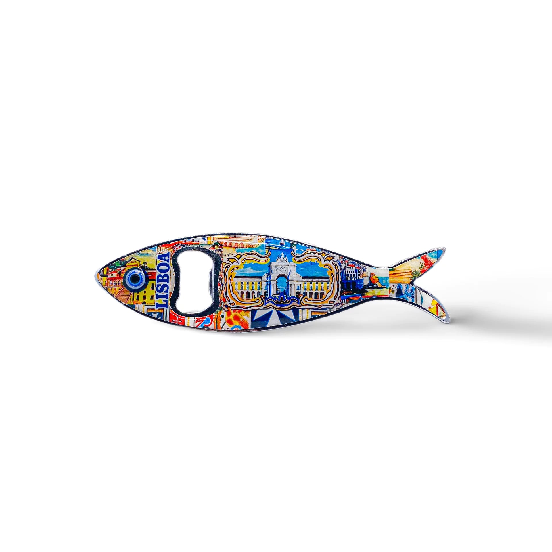 A metal fish-shaped bottle opener, designed to represent a sardine, is adorned with colorful, intricate details including a landmark building and the text "Lisboa." This charming Portugal souvenir features an opener hole where the fish's eye would be.