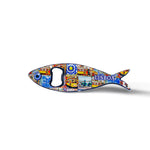 This sardine-shaped metal bottle opener is embellished with colorful, detailed artwork, featuring a well-known Lisbon building and the inscription "Lisboa." The opener hole is located at the fish's eye, adding to the charm of this Portuguese keepsake.