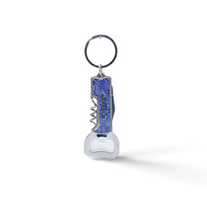 A multi-functional keychain featuring a metal bottle opener and corkscrew. The handle is blue with a textured surface, and the word "LIFEGUARD" is printed on it. The keyring is attached to the top, ready to be connected to a set of keys. Perfect for any adventure from Lisbon to your backyard.