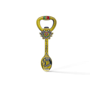 A decorative souvenir magnet, bottle opener, and spoon combination from Lisbon, Portugal. The handle features the Portuguese coat of arms and the word "Lisboa" along the stem. The spoon part depicts a traditional scene, possibly with historical or cultural significance.