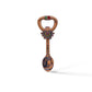 A decorative bottle opener shaped like a spoon, featuring the word "LISBOA" and ornate designs, including a crested emblem and a detailed scene on the spoon part. The handle displays the flag of Portugal. It also has a magnet for easy display on your fridge. The background is white.