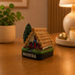 Rear view of a Madeira Santana House souvenir magnet highlighting the traditional triangular architecture and thatched roof construction.