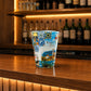 Front view of Madeira souvenir shot glass featuring Portuguese azulejo tiles, traditional caravel ship illustrations, and colorful island artwork