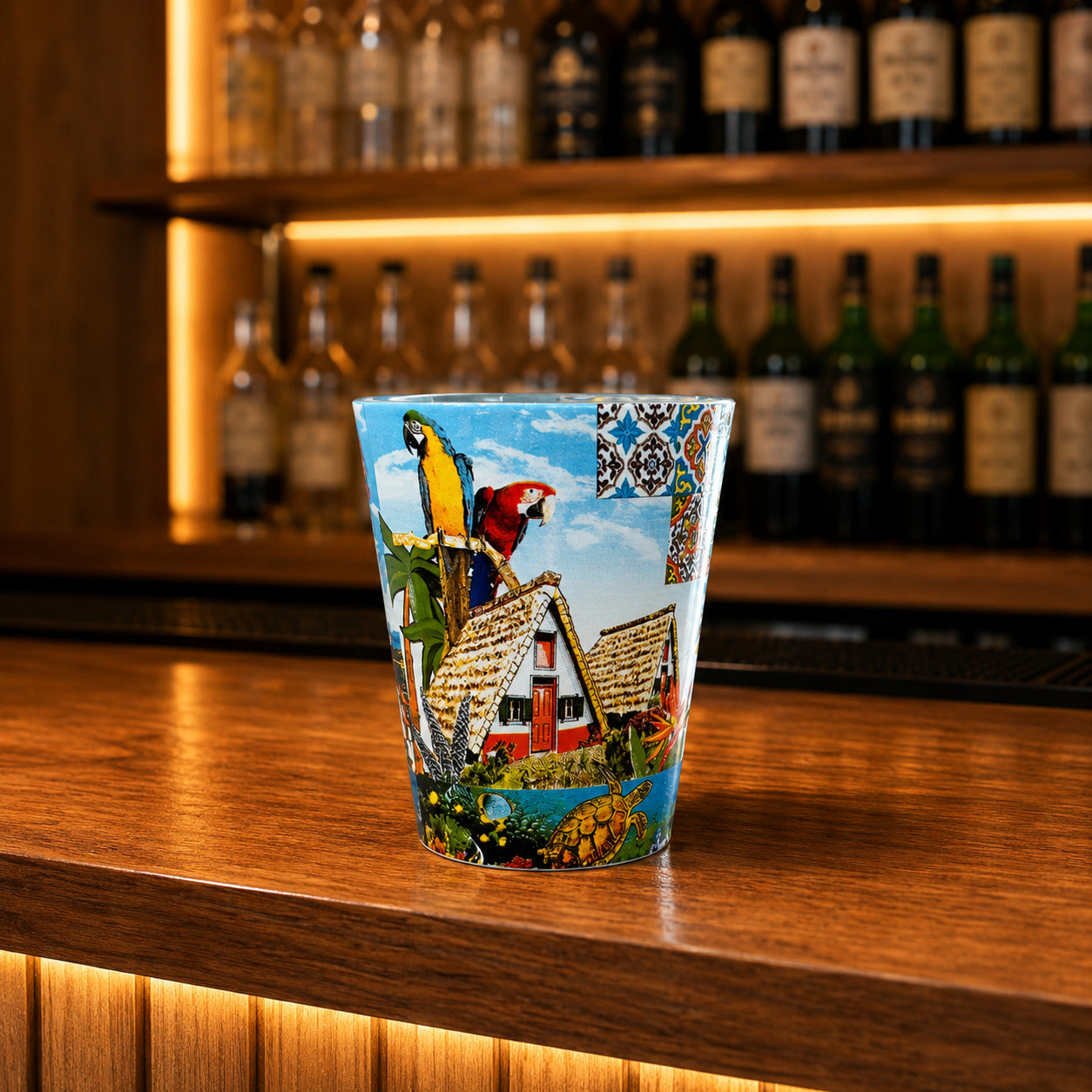 Madeira glass shot souvenir displaying coastal village scenery, seagulls, ocean landscape, and Portuguese decorative tile patterns