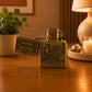 Open Portugal petrol lighter showcasing embossed historic landmarks and classic Zippo style ignition mechanism.