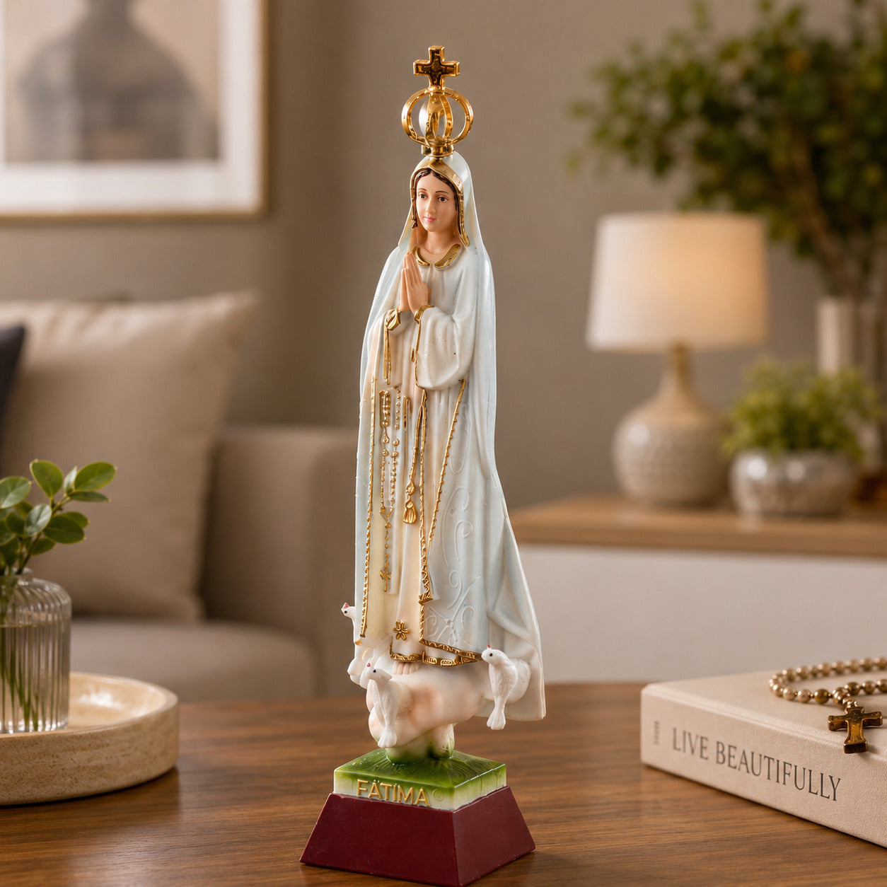 Our Lady of Fátima religious souvenir statue displayed indoors, showcasing detailed craftsmanship, crown, rosary, and traditional Marian design.
