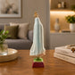 Rear view of an Our Lady of Fátima religious statue souvenir showing the flowing mantle and decorative finish inspired by the Sanctuary of Fátima.