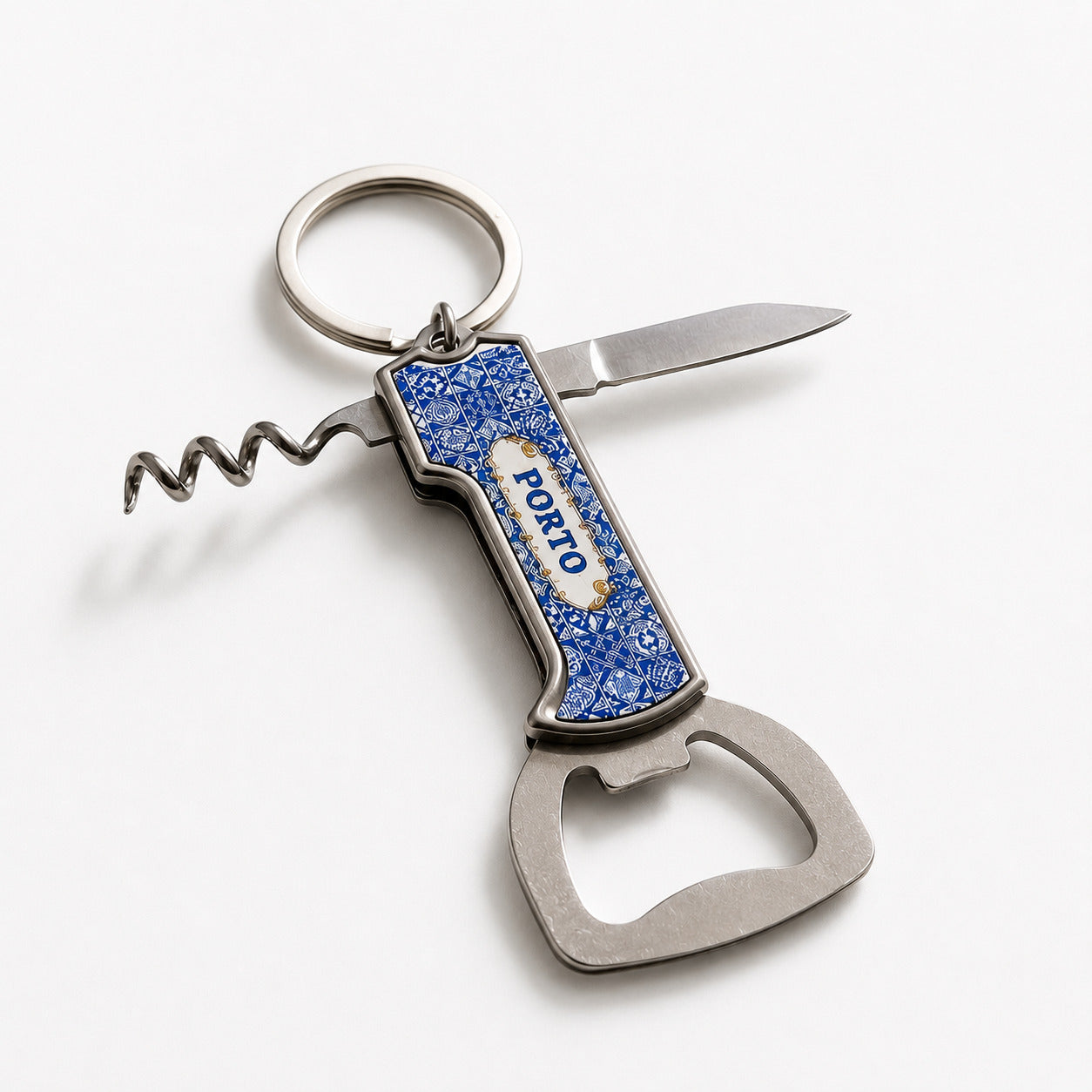 Front view of Porto azulejo multi-tool keychain showing bottle opener, corkscrew and decorative Portuguese tile design.