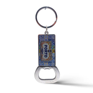 A rectangular keychain with a bottle opener at the bottom and a metal ring at the top. This vibrant souvenir features a colorful, intricate design with the word "Porto" in the center, celebrating the charm of this beautiful city in Portugal.