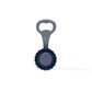 A bottle opener featuring a blue, scalloped circular base with a gold handle. The handle is adorned with a textured pattern and includes a small hole at the top for hanging. This delightful Portuguese souvenir stands out against a plain white background, adding a touch of charm to any kitchen.