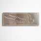Backside of Portugal metal souvenir sign showing engraved rooster and sardine shapes on a metallic surface