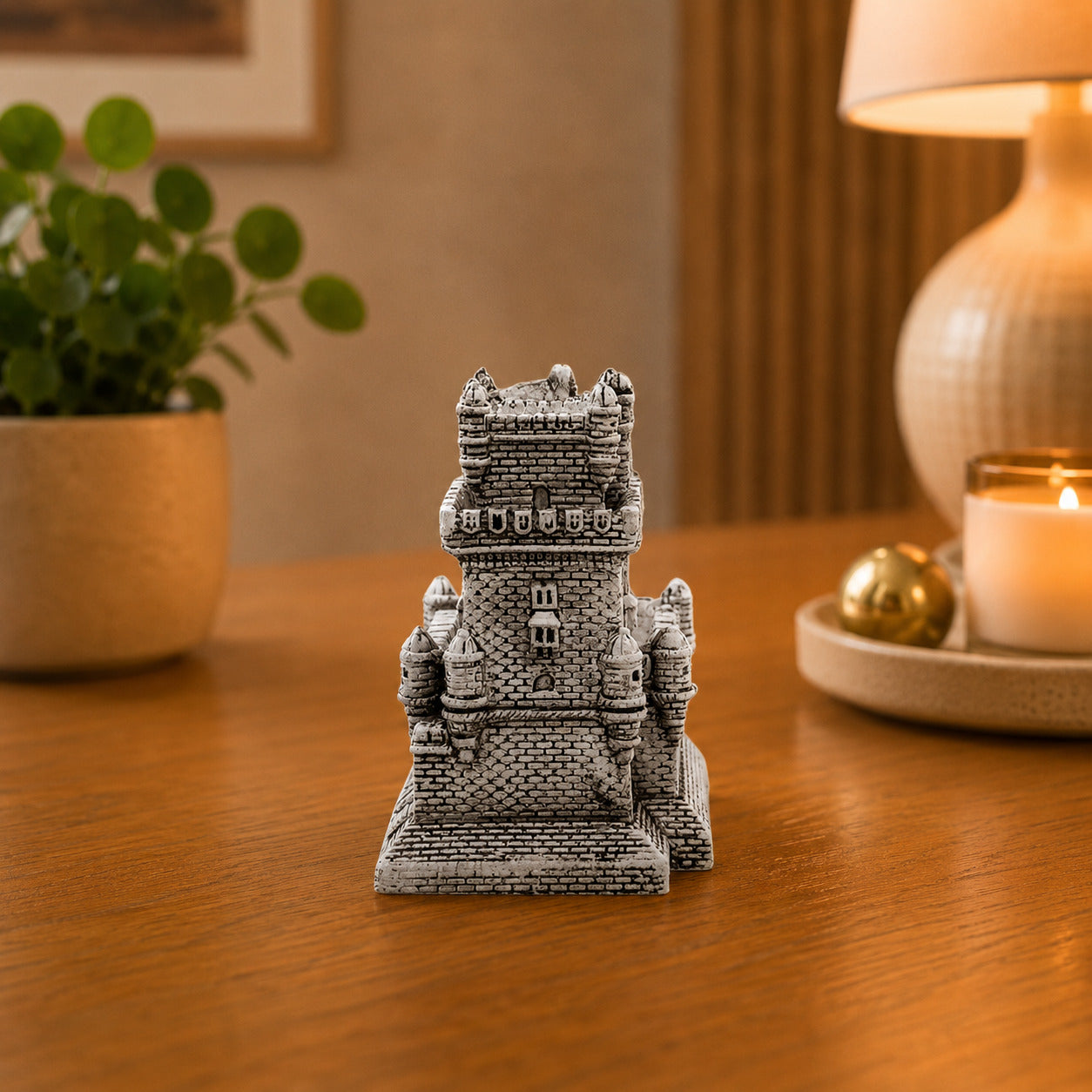 Portugal Belém Tower souvenir replica displayed on a wooden table, featuring the detailed stonework and fortified architecture of Lisbon’s iconic Torre de Belém.