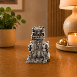 Portugal Belém Tower souvenir replica displayed on a wooden table, featuring the detailed stonework and fortified architecture of Lisbon’s iconic Torre de Belém.