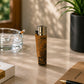 Portugal cork Clipper lighter featuring a historic Portuguese sailing ship from the Age of Discoveries photographed at an angle in a lifestyle environment with natural sunlight and decorative elements.
