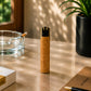Rear view of a Portugal cork Clipper lighter showcasing the natural cork finish and refillable Clipper mechanism in a lifestyle environment with soft natural light.