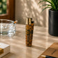 Portugal cork Clipper lighter featuring colourful Portugal lettering and classic Portuguese azulejo tile patterns photographed in a lifestyle environment with natural sunlight.