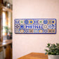 Portugal metal souvenir sign mounted on a wall displaying classic Portuguese azulejos tile designs in blue and multicolor