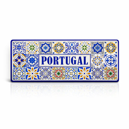 Portugal metal souvenir sign isolated on white background featuring traditional colorful Portuguese azulejos tile patterns