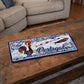 Portugal metal souvenir sign placed on a wooden table showing Barcelos rooster, stylized sardines and classic Portuguese tile design