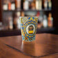 Portugal souvenir shot glass featuring iconic yellow Lisbon tram illustration surrounded by colorful Portuguese azulejo patterns on wooden surface.
