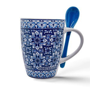 Set against intricate blue and white traditional Portuguese tile patterns, this ceramic souvenir coffee mug proudly displays "PORTUGAL" around its base. It comes with a matching blue spoon that fits snugly into a slot on the handle, making it both beautiful and functional.