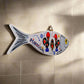 A fish-shaped souvenir wall decoration with "Portugal" inscribed on its side, showcasing three stylized roosters decorated in vibrant red, yellow, and blue details. The fish features a bright yellow eye and has a triangular hanger at the top, making it a striking and colorful addition to any space.