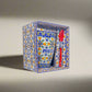 
A decorative ceramic coffee mug and spoon set packaged in an ornate box with traditional Portuguese patterns and designs. The mug prominently features the word "PORTUGAL" along with floral and geometric motifs, matching the decorative style of the box.
