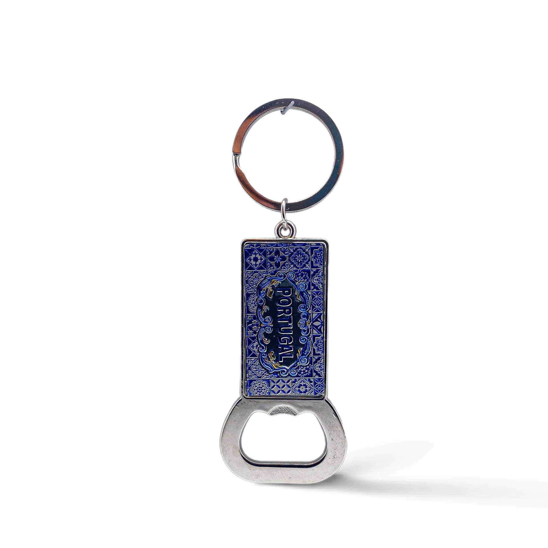 A rectangular keychain with an attached bottle opener featuring intricate blue designs and the word "Portugal" in the center. The circular, metallic ring contrasts beautifully with the blue and silver-toned opener, making it a perfect keepsake or magnet for any travel enthusiast.