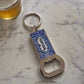 A rectangular keychain with a built-in bottle opener, featuring detailed blue patterns and "Portugal" displayed prominently in the center. The metallic ring complements the blue and silver-toned opener, creating a striking contrast. This elegant keepsake also doubles as a magnet, making it an ideal souvenir for any travel enthusiast.