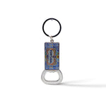 A souvenir keychain with a blue and colorful enamel rectangular pendant featuring intricate designs and the word "PORTUGAL." Attached to the pendant is a handy bottle opener at the bottom. The keychain ring is black.