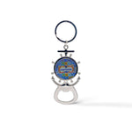 A metal key chain shaped like a ship's wheel and anchor with a colorful design in the center reading "Portugal". At the base, there is a bottle opener and a magnet on the back.