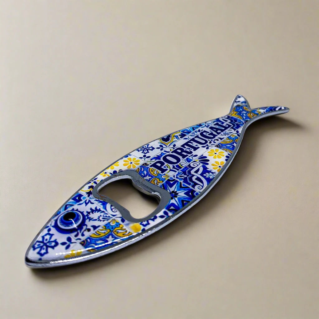 A colorful, fish-shaped metal bottle opener with detailed patterns and "PORTUGAL" written in blue across the body. This charming piece doubles as a fridge magnet, making it a practical and decorative keepsake.