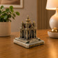 Three-quarter view of a Santa Luzia Basilica miniature souvenir displayed on a wooden table, highlighting its intricate details and elegant finish.