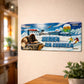 Serra da Estrela metal souvenir sign mounted on a wall featuring snowy mountains, a mountain dog, ski activity and alpine buildings