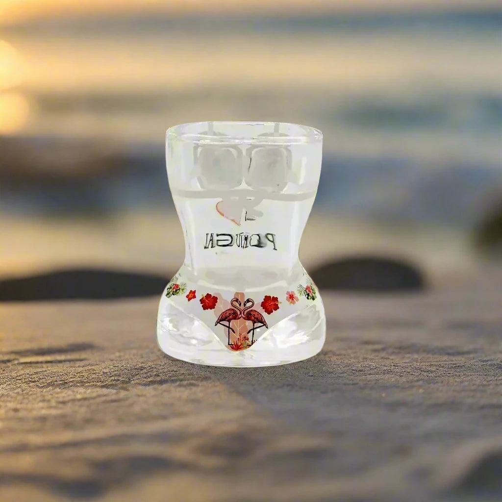 This hourglass-shaped shot glass features a vibrant design with "I ❤️ PORTUGAL" alongside cheerful pink flamingos and red flowers, embodying a joyful tribute to Portugal.