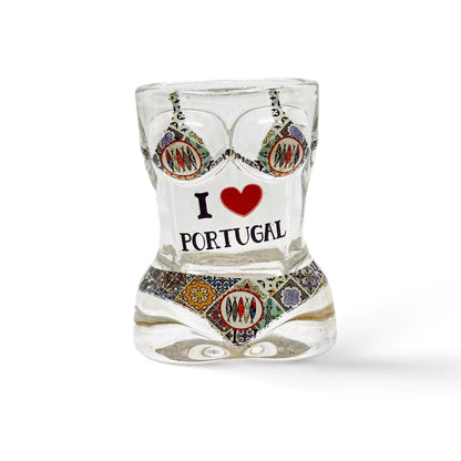 The shot glass, with its curvy hourglass shape, boasts the message "I ❤️ PORTUGAL" framed by vivid pink flamingos and red flowers. Its bright and lively design celebrates Portugal with flair.