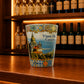 Decorative Viana do Castelo souvenir shot glass featuring Portuguese landmark illustrations and ornate azulejo-inspired artwork on a wooden bar counter