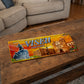 Viseu metal souvenir sign placed on a wooden table showing the cathedral, statue and city architecture in a vibrant illustration