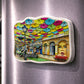Águeda souvenir magnet featuring colorful umbrella street art above a traditional pedestrian street in Portugal