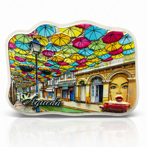 Águeda souvenir magnet featuring colorful umbrella street art above a traditional pedestrian street in Portugal