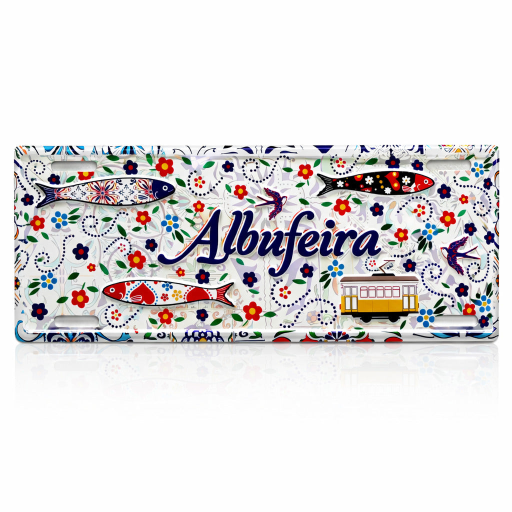 Albufeira Portugal souvenir metal sign with colorful sardines, Portuguese tram, swallows and decorative floral tile pattern.