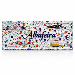 Albufeira Portugal souvenir metal sign with colorful sardines, Portuguese tram, swallows and decorative floral tile pattern.