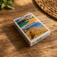 Albufeira souvenir poker card deck in a white box with Algarve beach artwork and Portugal travel design.