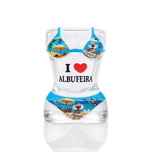 Albufeira souvenir shot glass shaped like a bikini-clad female torso with “I love Albufeira” and beach-themed illustrations in a playful design.