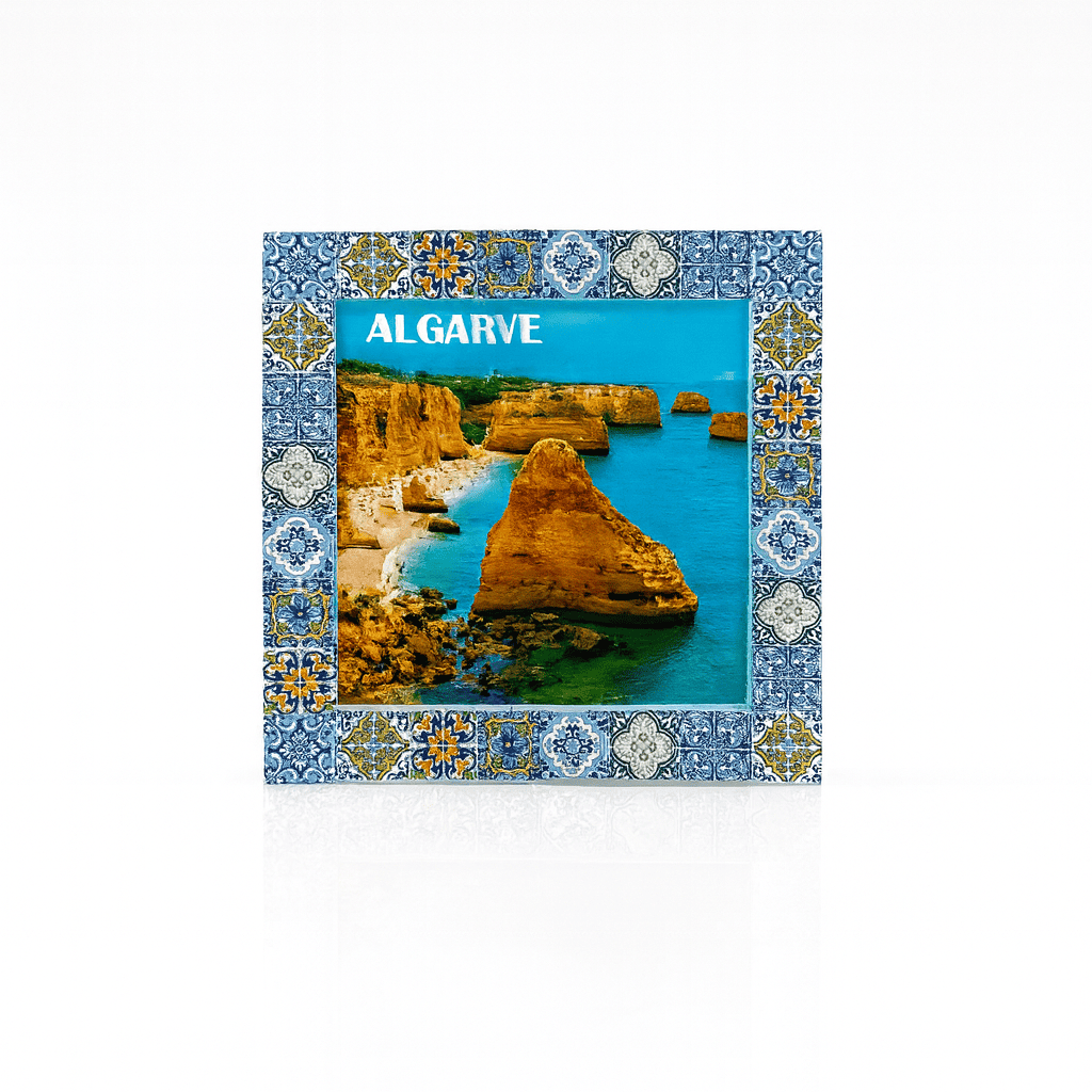 Magnet featuring a scenic coastal photograph of the Algarve, bordered by traditional Portuguese azulejo tile patterns in colorful ceramic-inspired designs