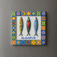 Decorative tile with three fish designs and 'Algarve' text on a colorful border against a gray background.