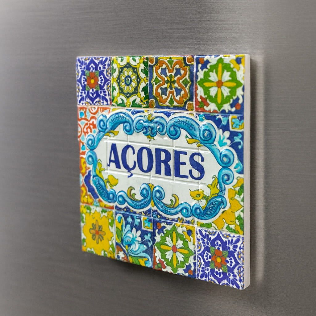 Decorative tile with colorful patterns and 'Açores' text on a metallic surface
