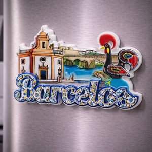 Barcelos souvenir magnet with Galo de Barcelos illustration, historic buildings and traditional tile patterns placed on a fridge